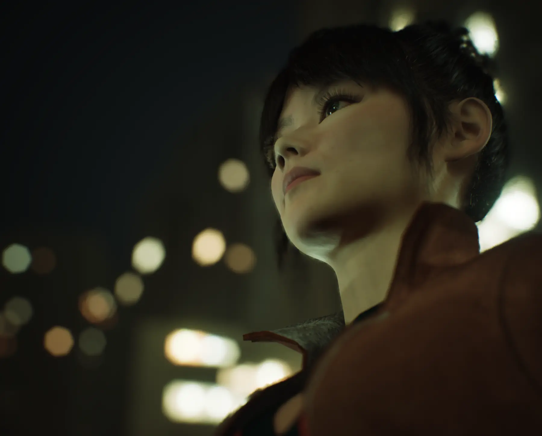 Low-angle portrait of Myla against blurred city lights